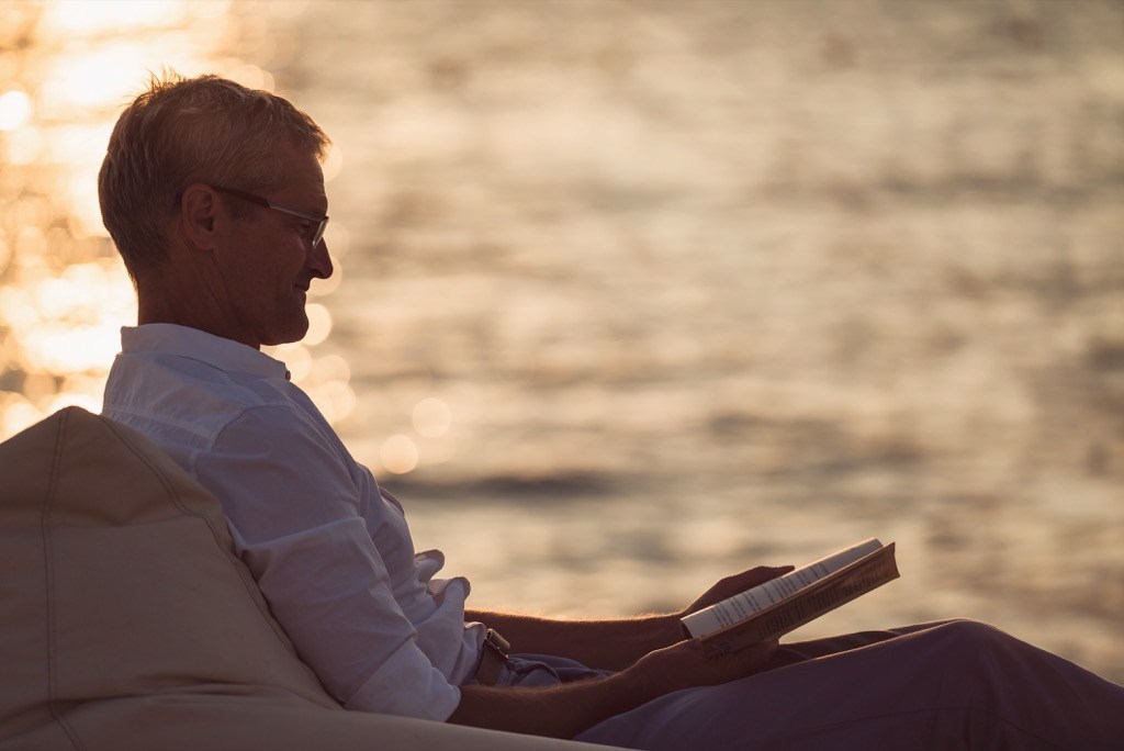 Man Reading Poems by the Ocean